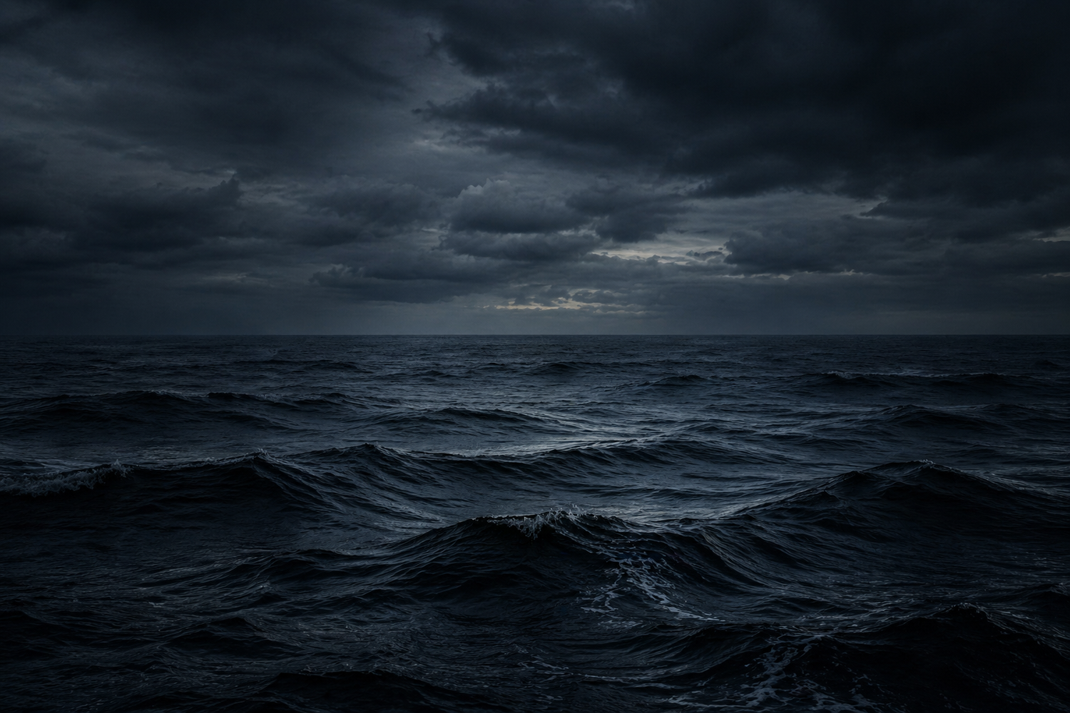 Dark and stormy ocean with heavy clouds overhead